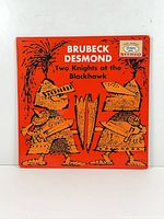 Front cover showing title, artist names and knight illustration