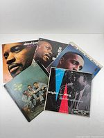 All five record jackets laid out face-up