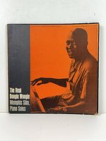 Front album cover showing artist photo and title