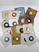 Overview of all sixteen 7-inch singles with sleeves