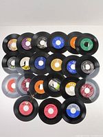 Overhead view of all 20 unsleeved 45 RPM records