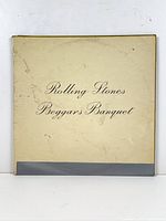 Front of cream gatefold sleeve with scripted title