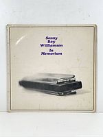 Front sleeve showing title, artist, harmonica image