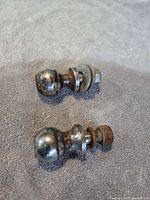 Two trailer hitch balls showing size and condition