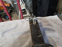 Hitch pin and retaining clip on square receiver tube