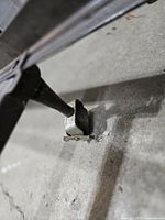 Close-up of leg with caster and locking clip