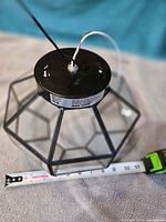 Fixture top view showing wiring, metal cap, size reference