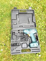 Teal Mastercraft cordless drill kit with charger and accessories in molded case