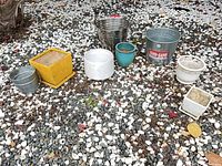 all eight planters on gravel, front angle