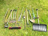 Tools laid out on grass, shows variety and condition