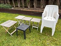 Full lot showing stack of six white chairs, three beige folding tables, one black square table