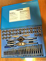 Open case showing full set of dies, taps, wrenches and accessories