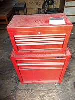 Front view of stacked Waterloo red tool chest showing drawers and general condition