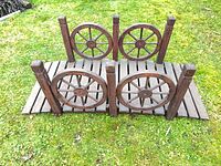 Overhead view showing full bridge with wagon-wheel panels and slatted deck