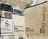 Overall view of drawing pads and pastel sets