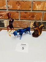 overall view of three glass animal figurines on table