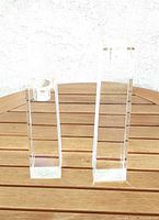 Two crystal candleholders, different heights
