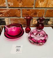 All four pink glass pieces: two bowls front, two bud vases rear