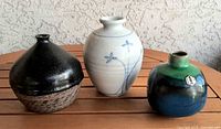 Group shot showing all three pottery vases for scale and condition