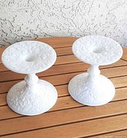 Both Westmoreland bramble milk glass candlesticks side by side