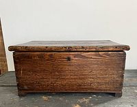 Front view closed showing keyhole and wood grain