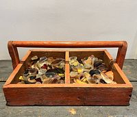 Tool box filled with tumbled glass