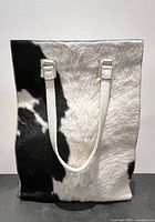 Front view showing cowhide panel and shoulder straps