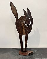 Full view of plasma-cut cat sculpture and metal mouse on base