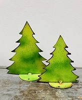 Front view of both chartreuse steel trees showing size difference and bases