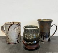 All three handmade mugs side by side
