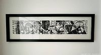 Full view of framed woodblock print on wall