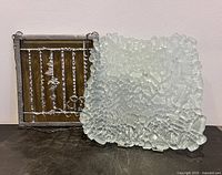 Both items side by side: window catcher on left, fused glass plate on right