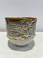 Front view showing relief patterns and glaze tones