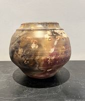 Full view of signed woodfired planter showing overall form and coloration