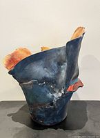 Front view showing asymmetrical shape and color contrast