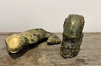 Salamander and head sculptures together