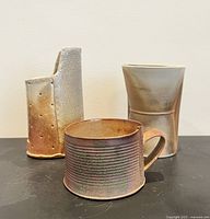 Group shot showing all three pottery pieces together