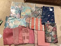 All fabric pieces laid out showing variety of colours and patterns