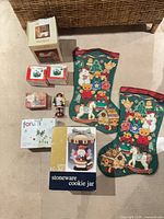 Lot overview with cookie jar box, two stockings, nutcracker, four boxed ornaments