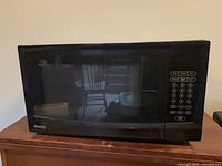 Front view showing entire microwave with keypad and door