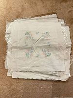 Stack of embroidered pillow cases viewed from above