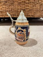 Front view showing Bavarian chalet relief and pewter lid