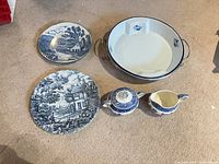 Overview of all five ceramic pieces on carpet