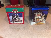 Two boxed porcelain Christmas village buildings
