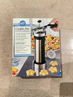 Front of Wilton Cookie Pro box showing cookie press image