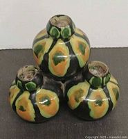 Top view showing five candle sockets and hand-painted glaze