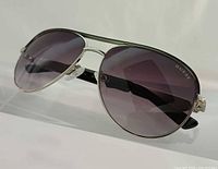 Front angled view of Guess aviator sunglasses showing lens tint and frame design
