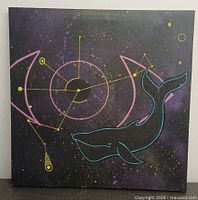 Front view of square canvas with whale and constellation imagery