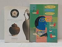 Front covers of both books standing side by side