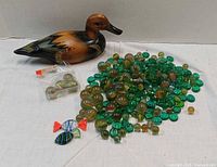 group shot of duck decoy and glass pieces